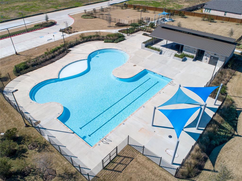 Aerial view of the Stonecreek Estates resort-style pool, splash pad and shaded amenity deck