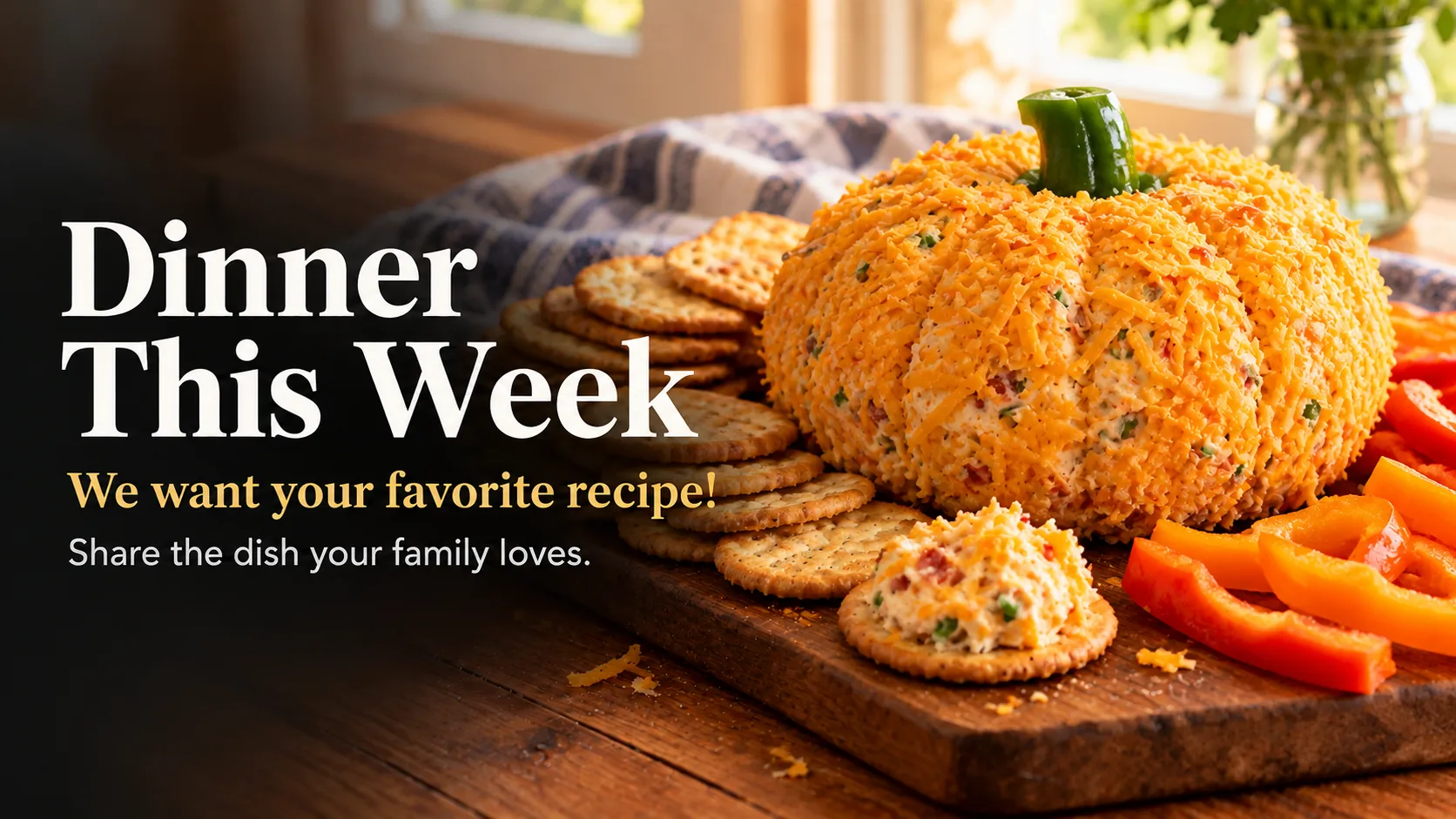 A cheddar-coated cheese ball shaped and grooved like a pumpkin with a bell pepper stem, on a board with crackers and pepper slices.